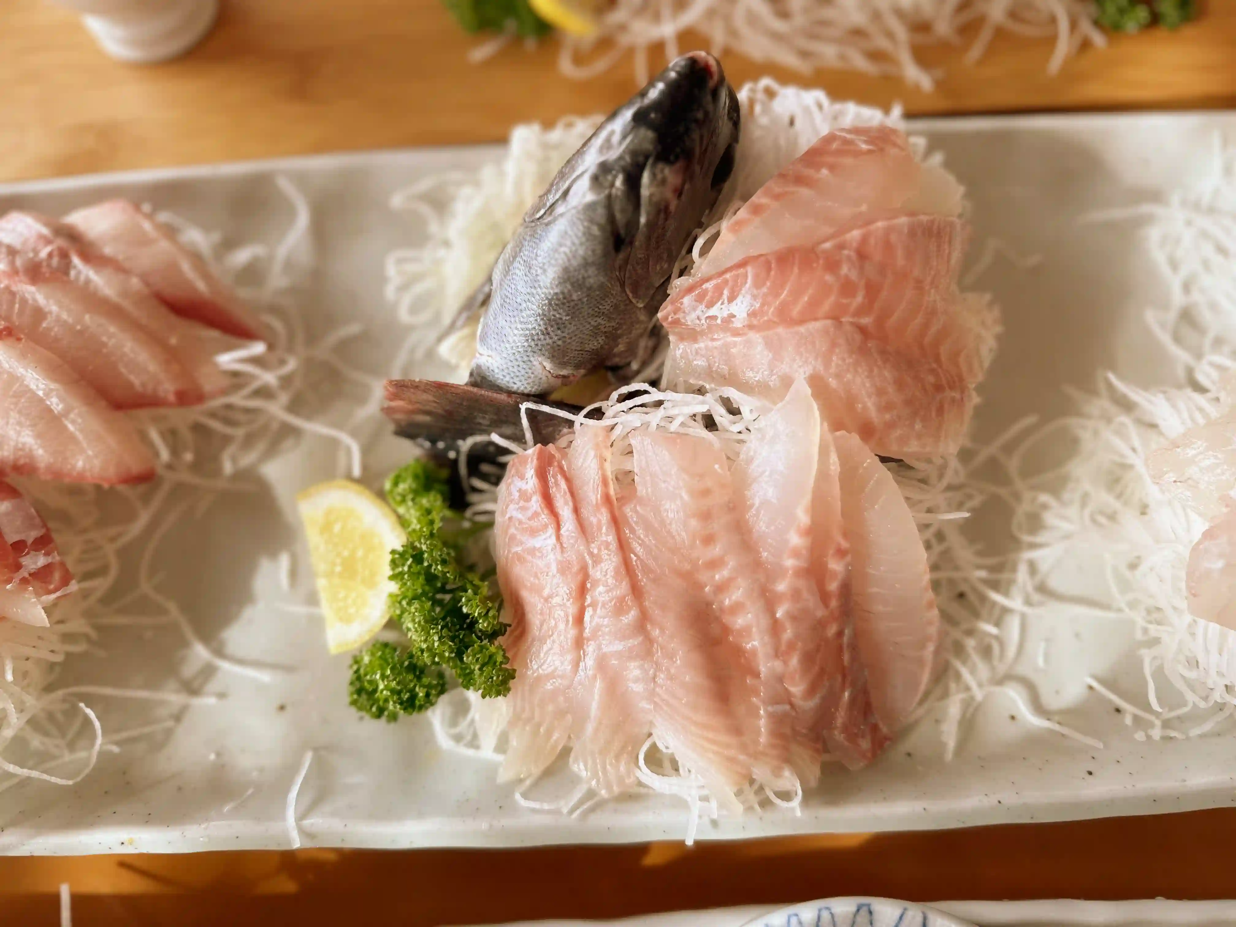 The main course features natural live sashimi